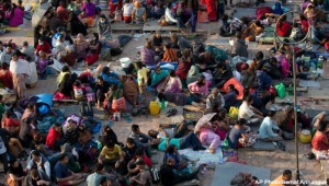 People gather on an open space for security reasons at Basantapur Durbar Square, damaged in Saturday’s earthquake, in Kathmandu, Nepal, Sunday, April 26, 2015. The earthquake centered outside Kathmandu, the capital, was the worst to hit the South Asian nation in over 80 years. It destroyed swaths of the oldest neighborhoods of Kathmandu, and was strong enough to be felt all across parts of India, Bangladesh, China's region of Tibet and Pakistan. (AP Photo/Bernat Armangue)